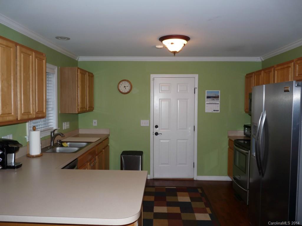 1115 Hess Road Concord, NC 28025 - Photo 5 of 21 a kitchen with a refrigerator and a sink