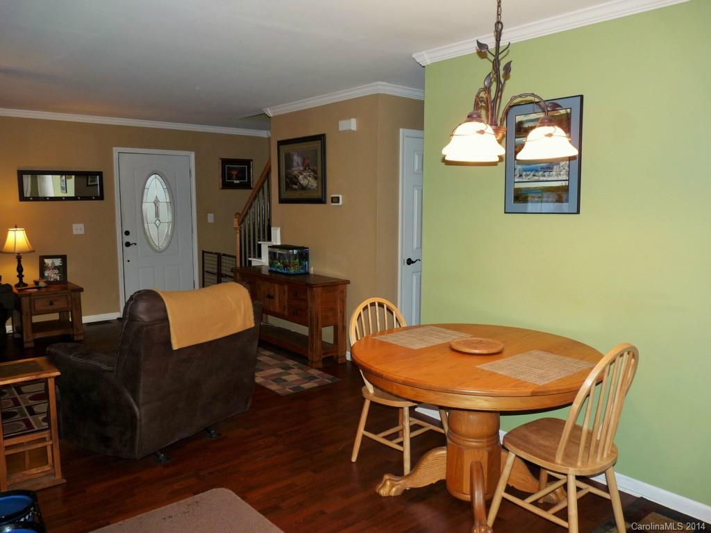 1115 Hess Road Concord, NC 28025 - Photo 7 of 21 a view of a dining room with furniture and wooden floor