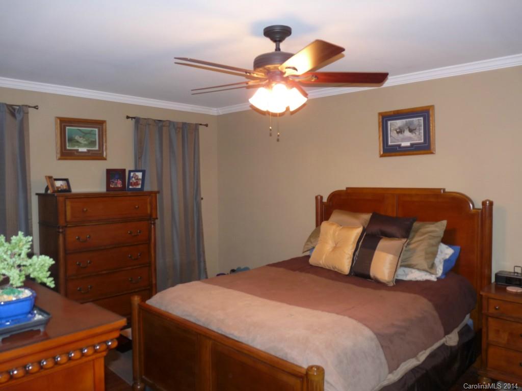 1115 Hess Road Concord, NC 28025 - Photo 8 of 21 a bedroom with a bed and a dresser
