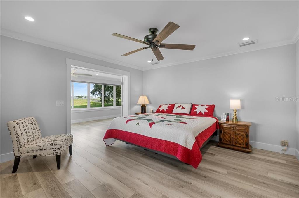 718 Canberra Road Winter Haven, FL 33884 - Photo 11 of 36 a bedroom with a bed and window