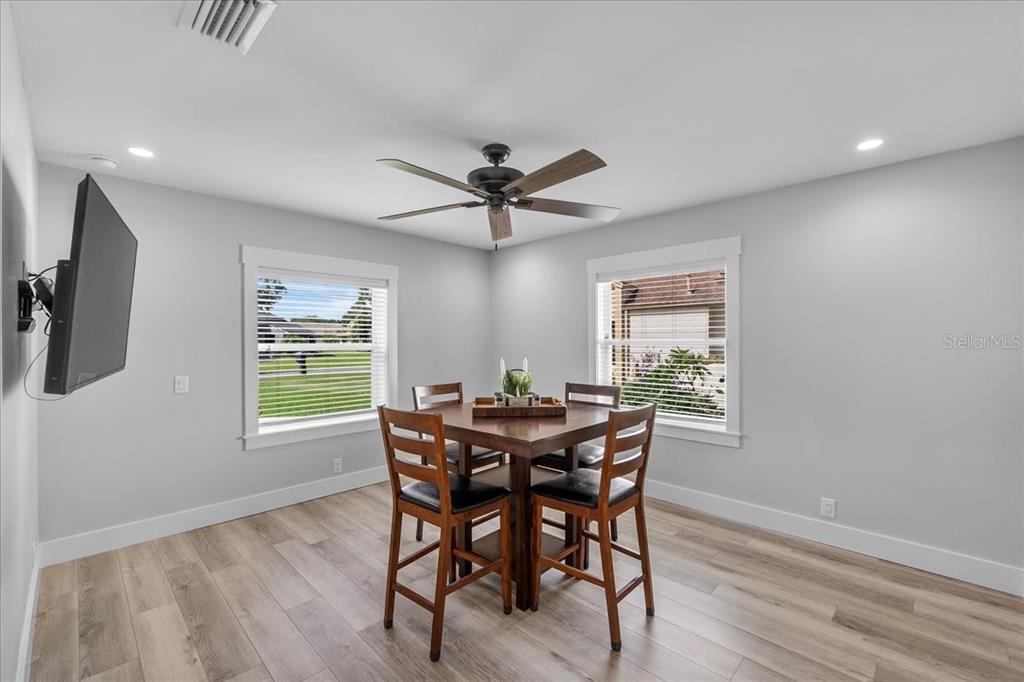 718 Canberra Road Winter Haven, FL 33884 - Photo 22 of 36 a view of a dining room with furniture and a window