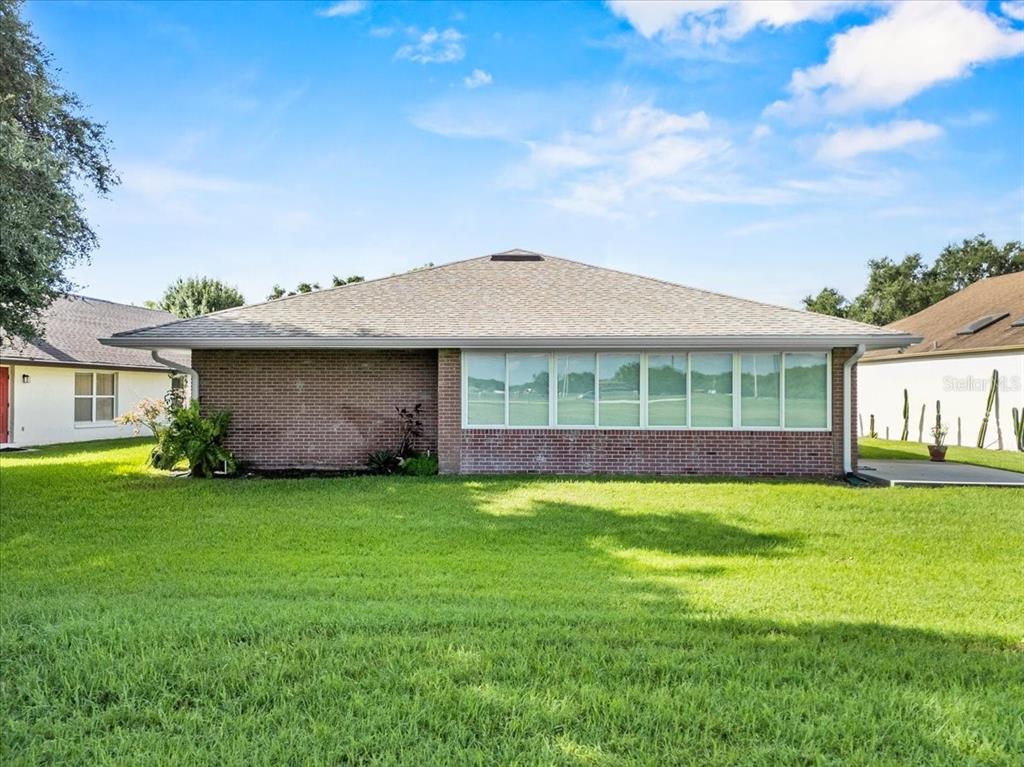 718 Canberra Road Winter Haven, FL 33884 - Photo 27 of 36 a view of a house with a garden