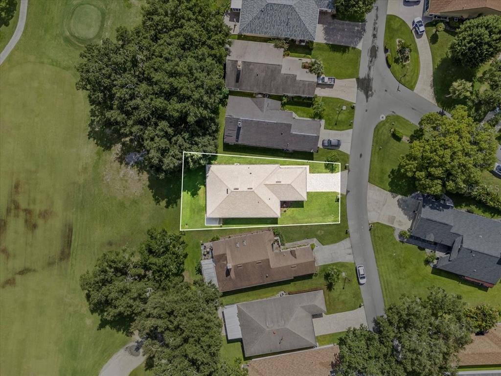 718 Canberra Road Winter Haven, FL 33884 - Photo 35 of 36 an aerial view of a house with a garden