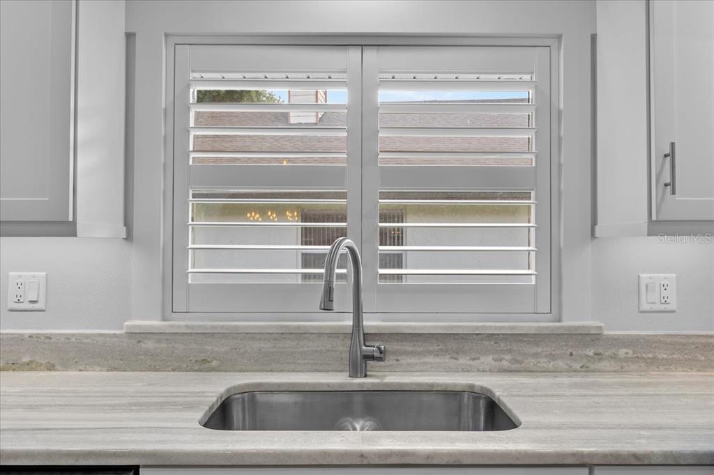 718 Canberra Road Winter Haven, FL 33884 - Photo 8 of 36 a close view of sink and tap