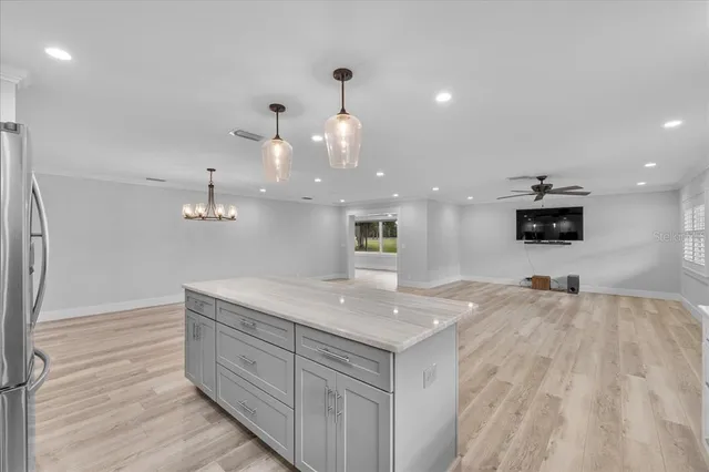 a kitchen with a sink and a refrigerator