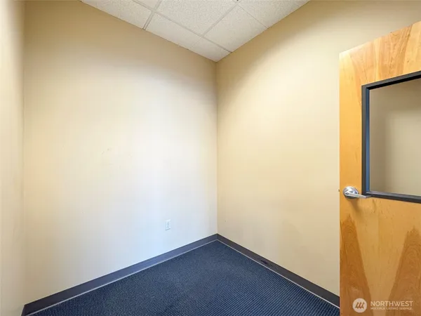 an empty room with a bathroom