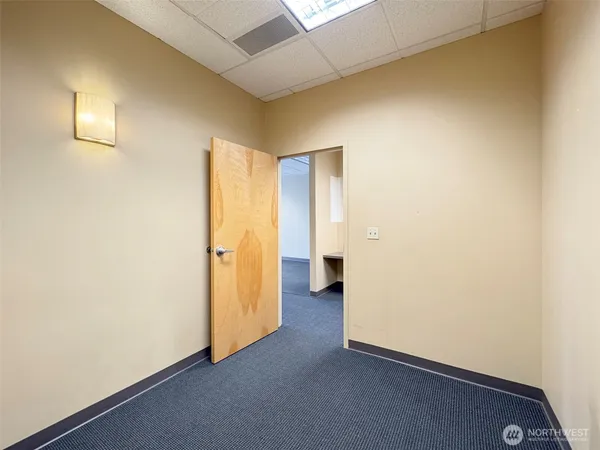 a bathroom with a granite countertop sink and a bathtub