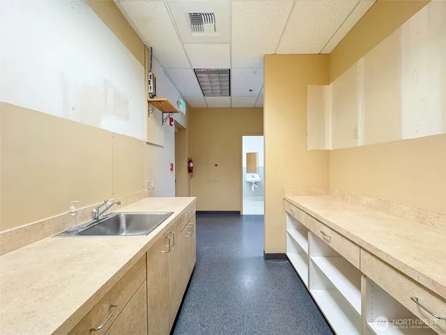 a fire hydrant in middle of the forest