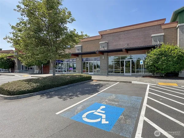 a view of a white house with a swimming pool