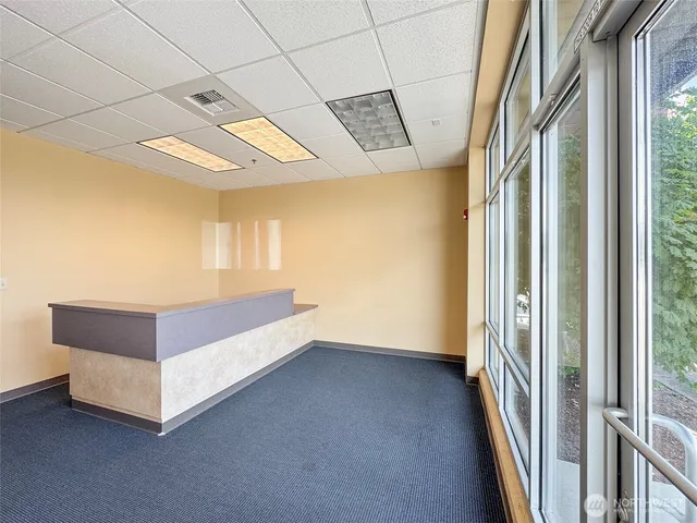 a room with windows and a hallway