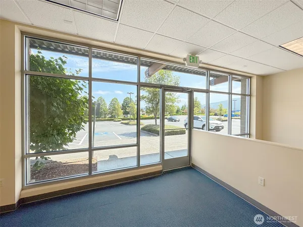 a view of an empty room with a large window
