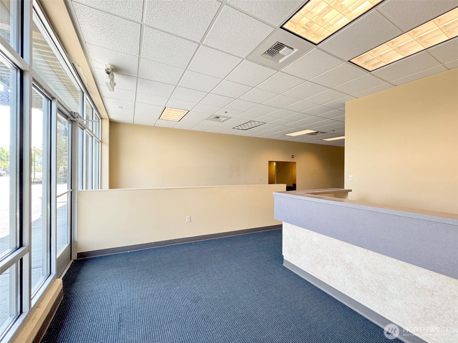 1400 West Washington Street, Unit 102 Sequim, WA 98382 - Photo 7 of 35 a view of an empty room with a window