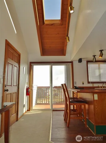 a kitchen with stainless steel appliances granite countertop a sink stove and microwave