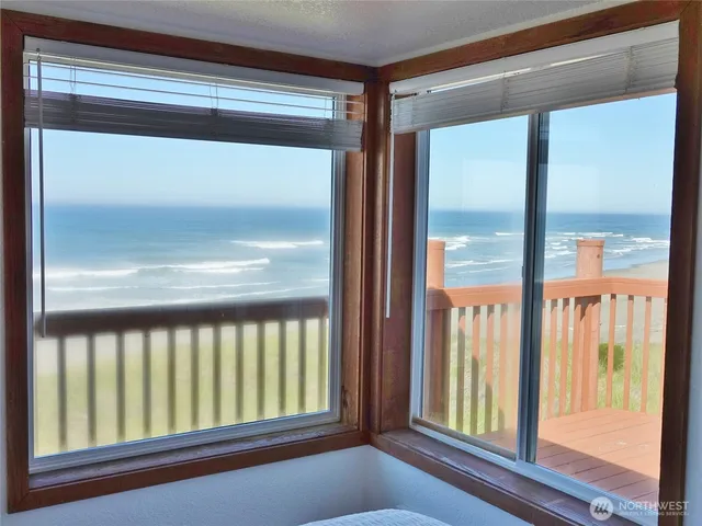 a bedroom with a bed and a bathroom