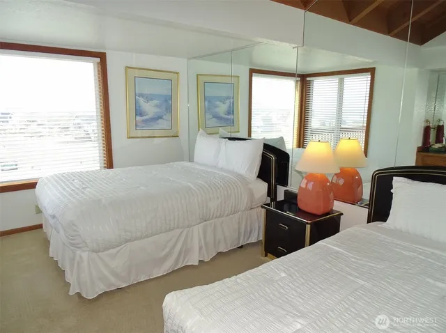 a bedroom with bed and window