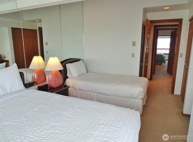 a bedroom with a bed and a dresser