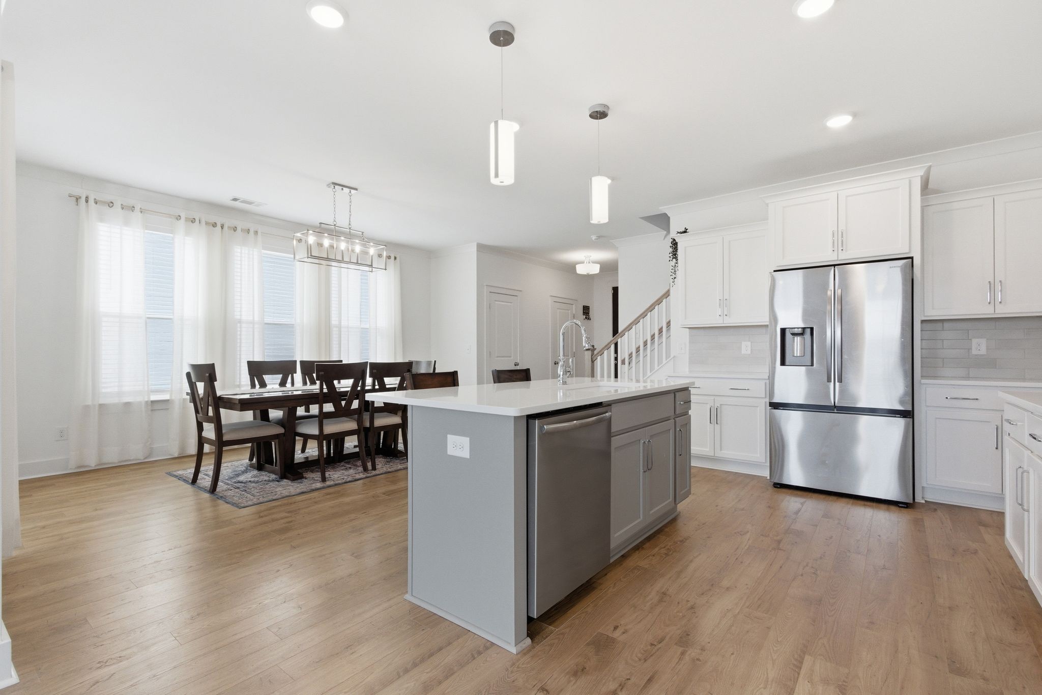 688 Conifer Drive Spring Hill, TN 37174 - Photo 11 of 40 a kitchen with refrigerator cabinets and wooden floor