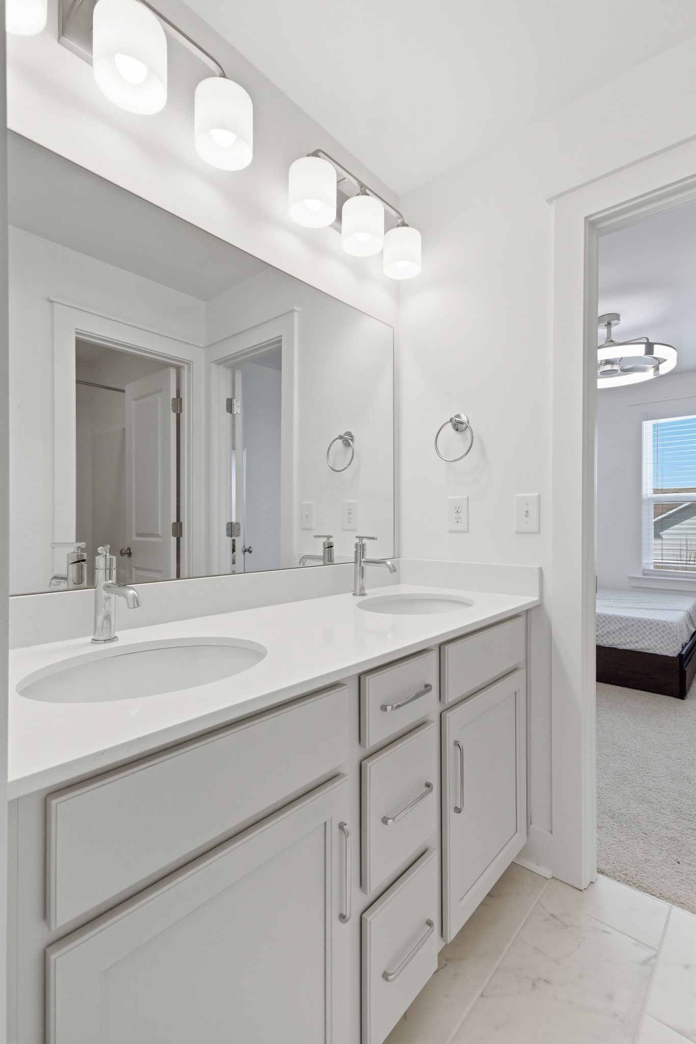 688 Conifer Drive Spring Hill, TN 37174 - Photo 25 of 40 a bathroom with a double vanity sink and a mirror