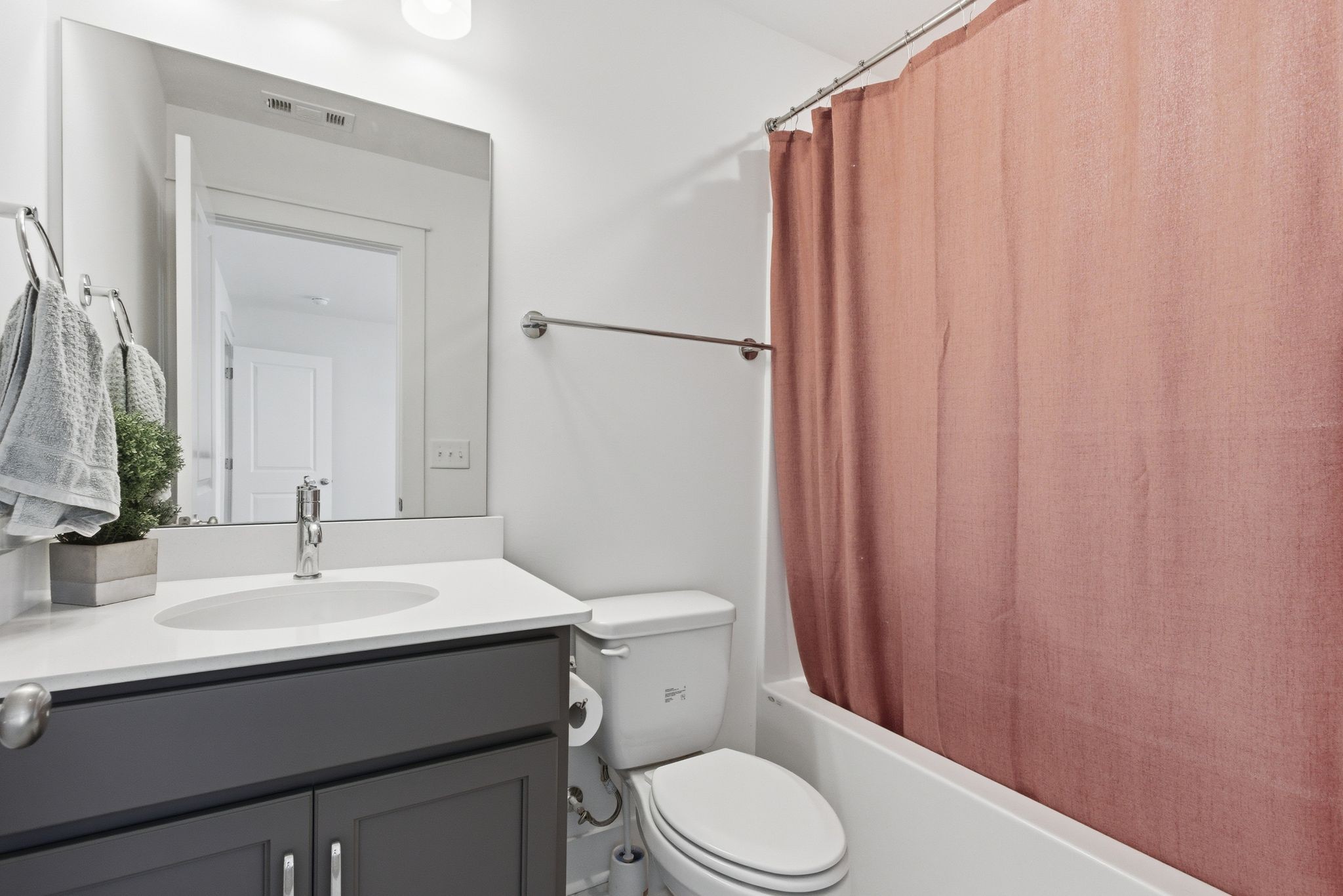 688 Conifer Drive Spring Hill, TN 37174 - Photo 30 of 40 a bathroom with a sink a toilet and shower curtain