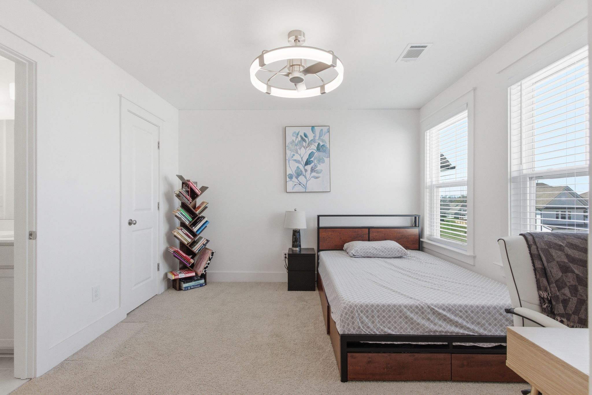 688 Conifer Drive Spring Hill, TN 37174 - Photo 33 of 40 a bedroom with a bed and a chandelier