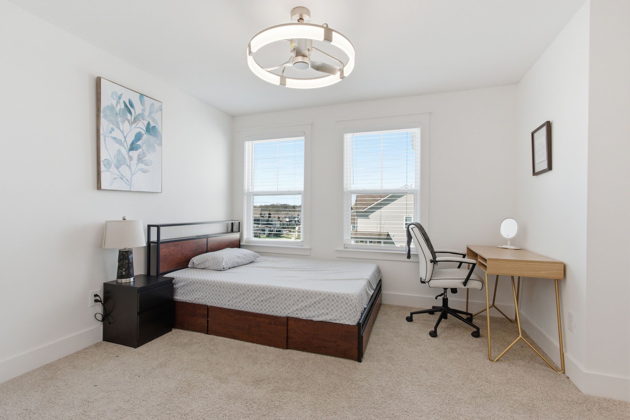 688 Conifer Drive Spring Hill, TN 37174 - Photo 34 of 40 a spacious bedroom with a bed a table and painting