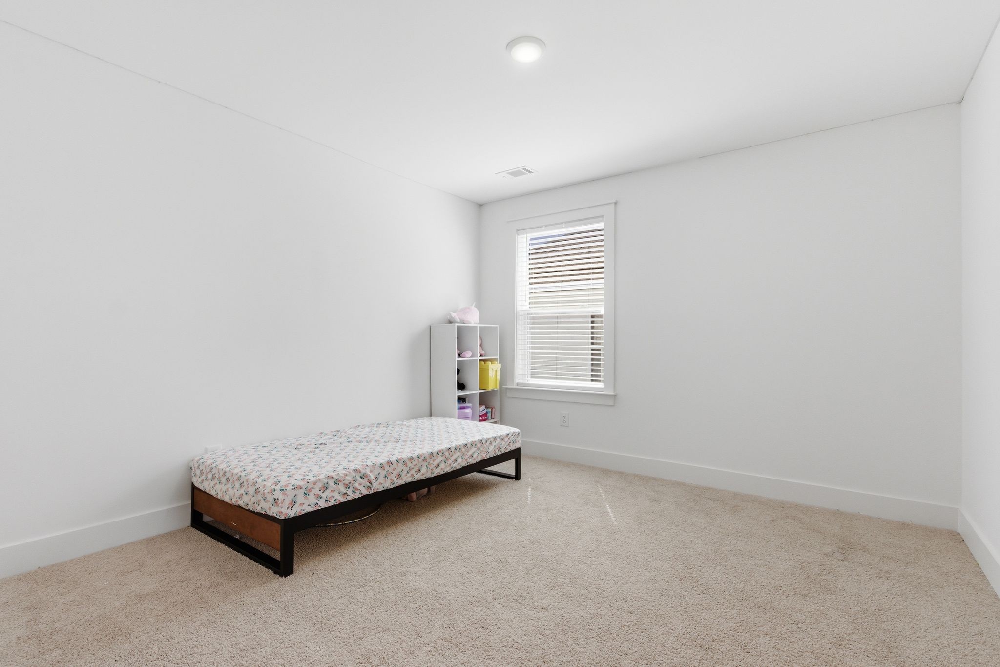 688 Conifer Drive Spring Hill, TN 37174 - Photo 36 of 40 a spacious bedroom with a bed and a window