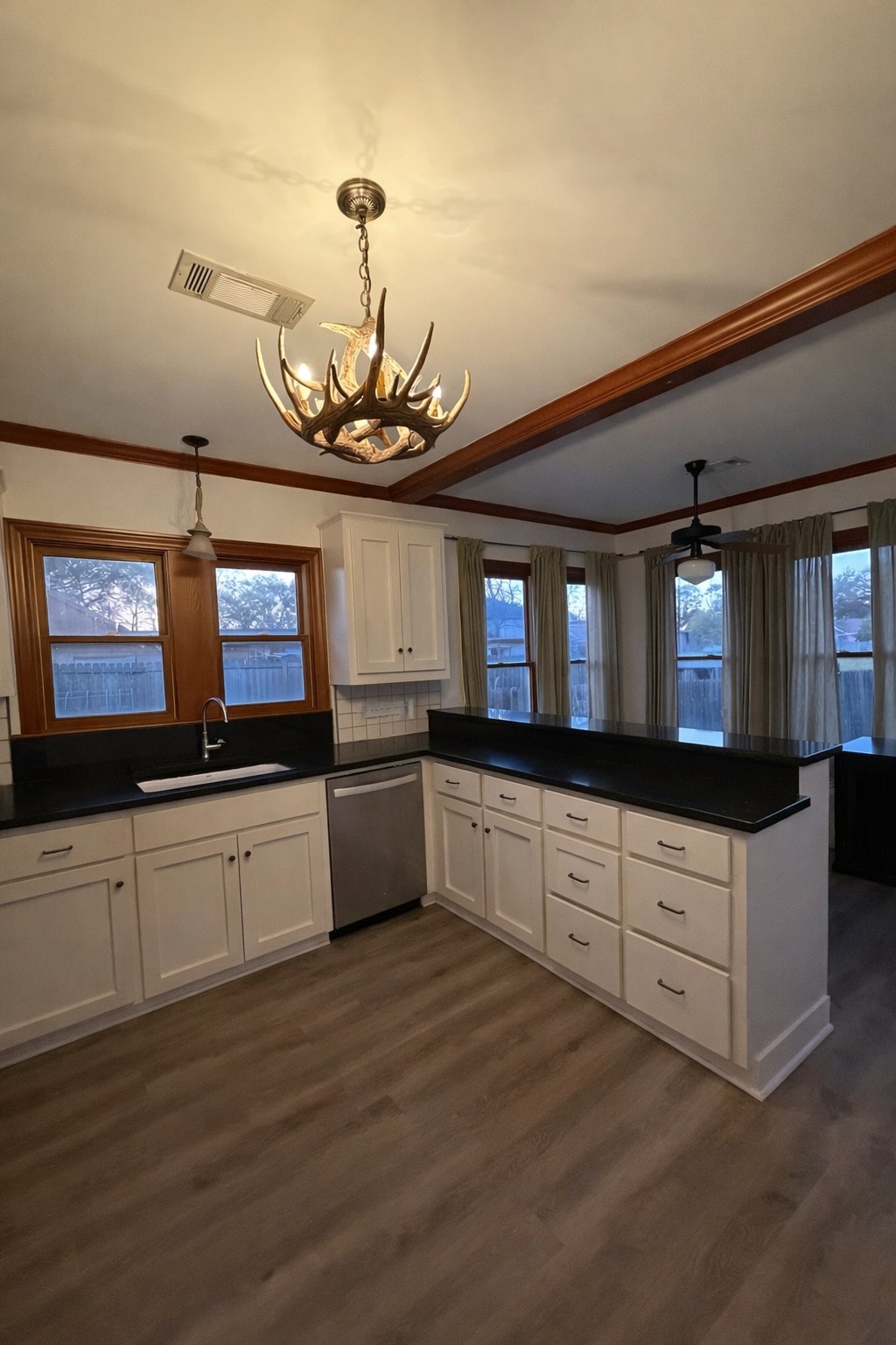 403 4th Street Humble, TX 77338 - Photo 5 of 15 Kitchen with abundance of storage and walls of windows.