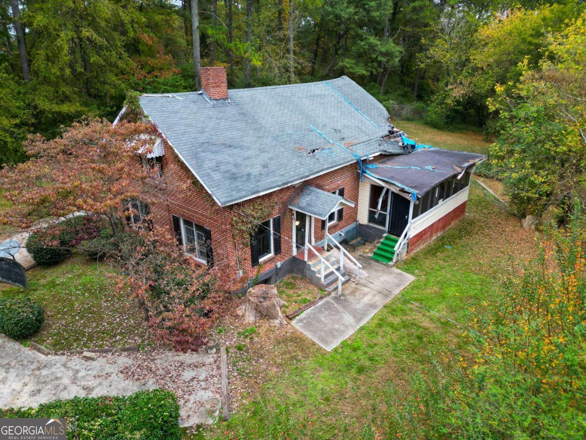 1345 Gun Club Road Northwest Atlanta, GA 30318 - Photo 11 of 12 an aerial view of a house with swimming pool and big yard