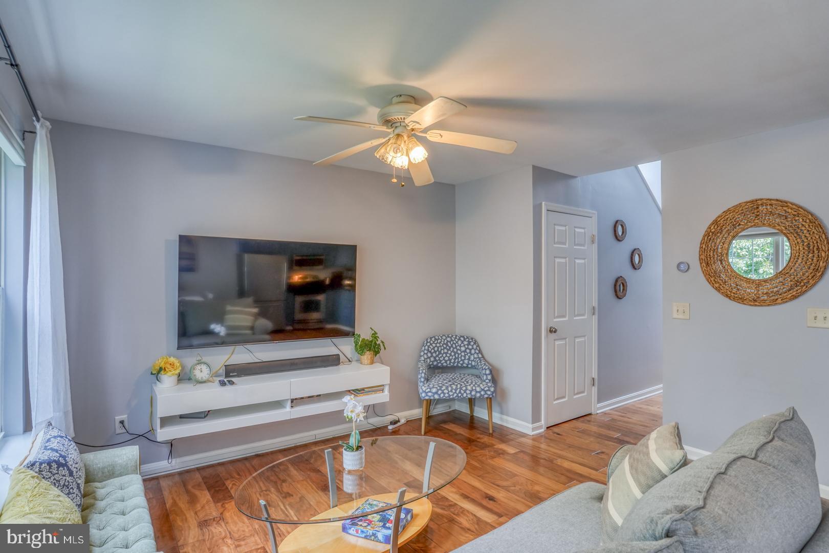 34527 Oakley Court, Unit 24 Lewes, DE 19958 - Photo 6 of 28 Living room with hall leading to front door