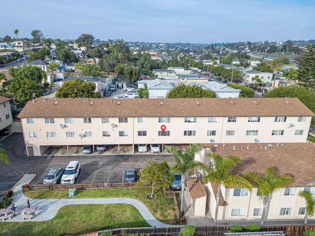 an aerial view of a swimming pool and mountain view