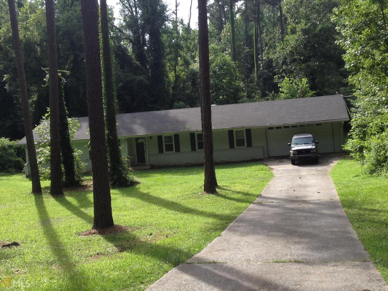a view of a patio with a yard