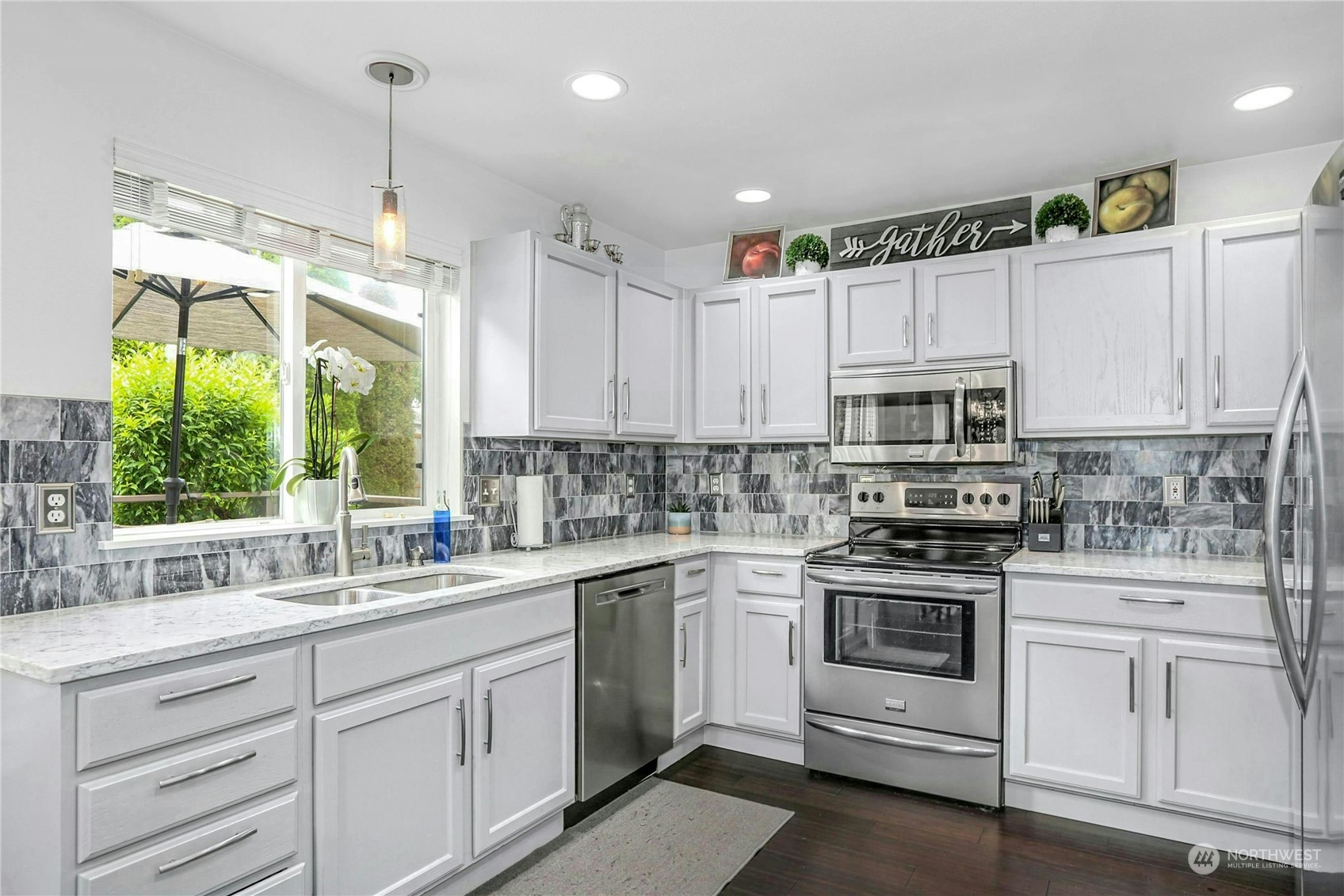 15028 51st Drive Southeast Bothell, WA 98012 - Photo 12 of 31 a kitchen with white cabinets appliances and window