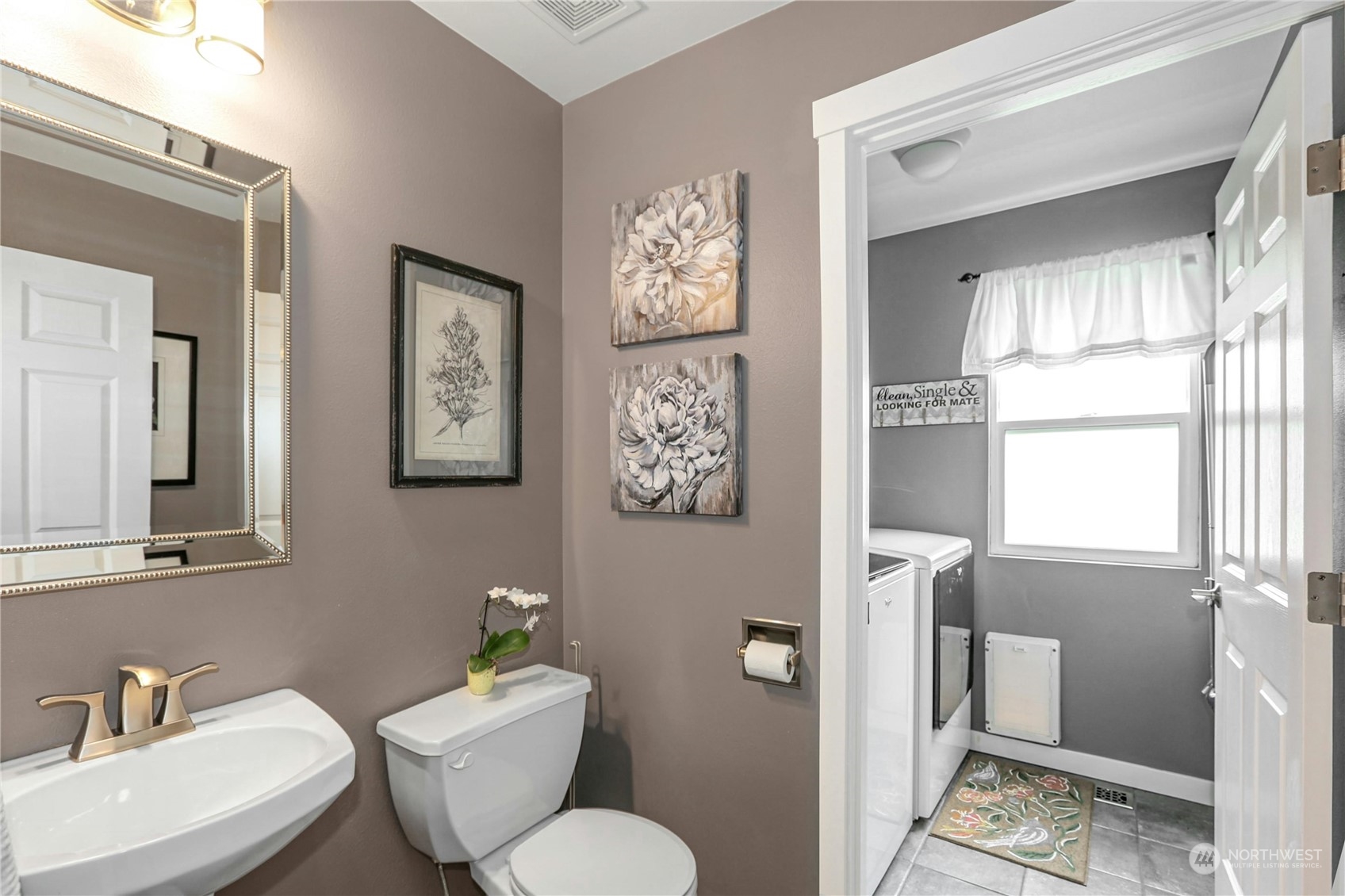 15028 51st Drive Southeast Bothell, WA 98012 - Photo 15 of 31 a bathroom with a toilet a sink and a mirror