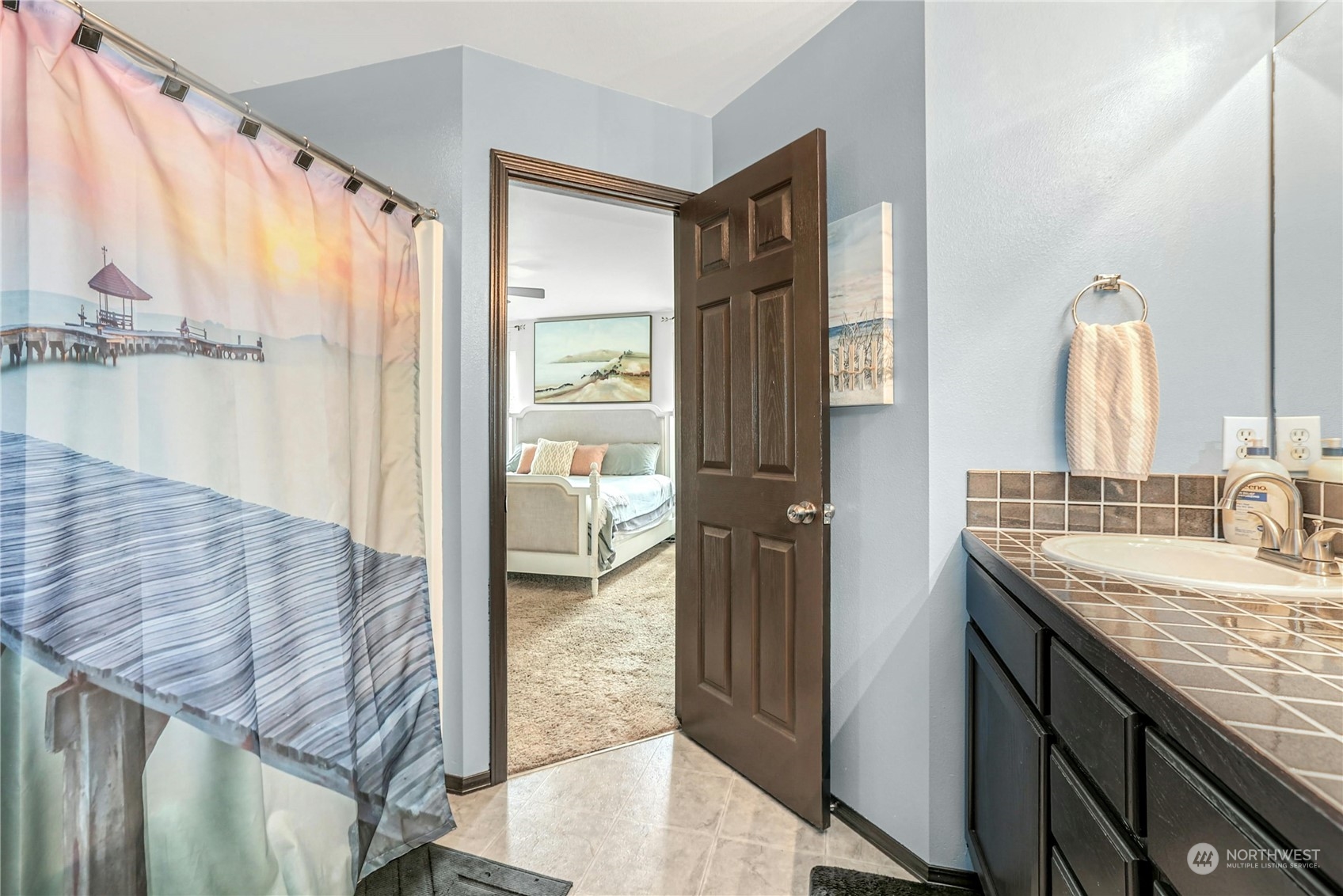 15028 51st Drive Southeast Bothell, WA 98012 - Photo 19 of 31 a bathroom with a granite countertop sink and a mirror