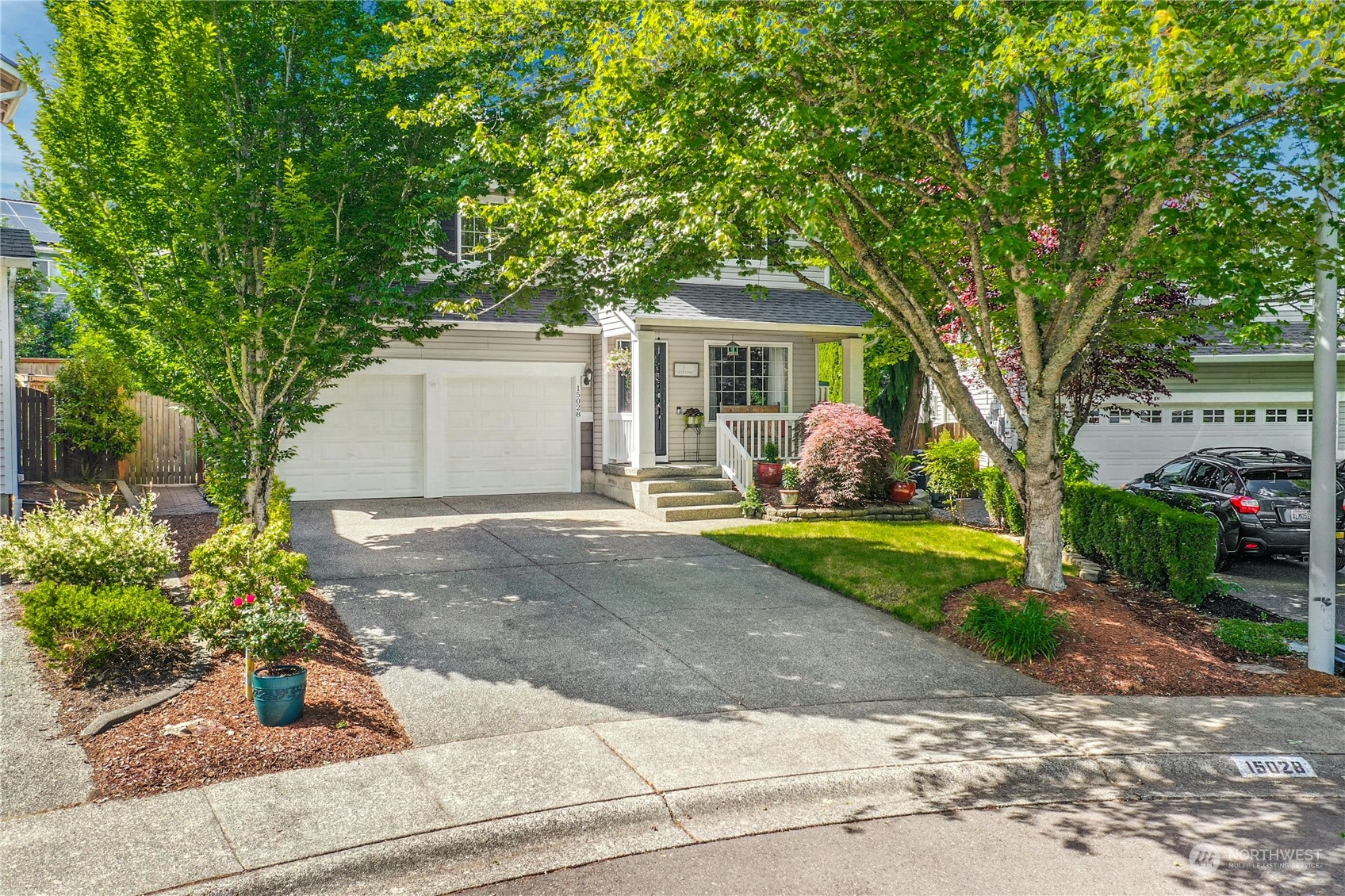 15028 51st Drive Southeast Bothell, WA 98012 - Photo 2 of 31 a front view of a house with garden