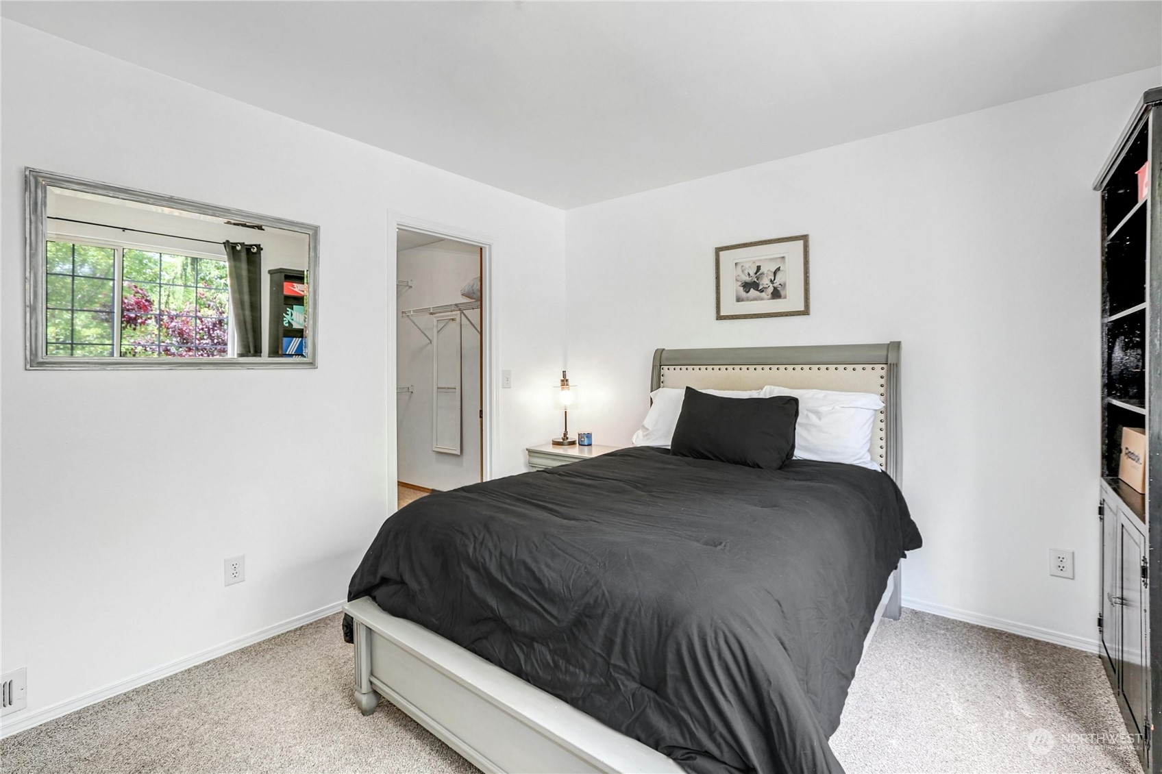 15028 51st Drive Southeast Bothell, WA 98012 - Photo 21 of 31 a bedroom with a bed and wall painting