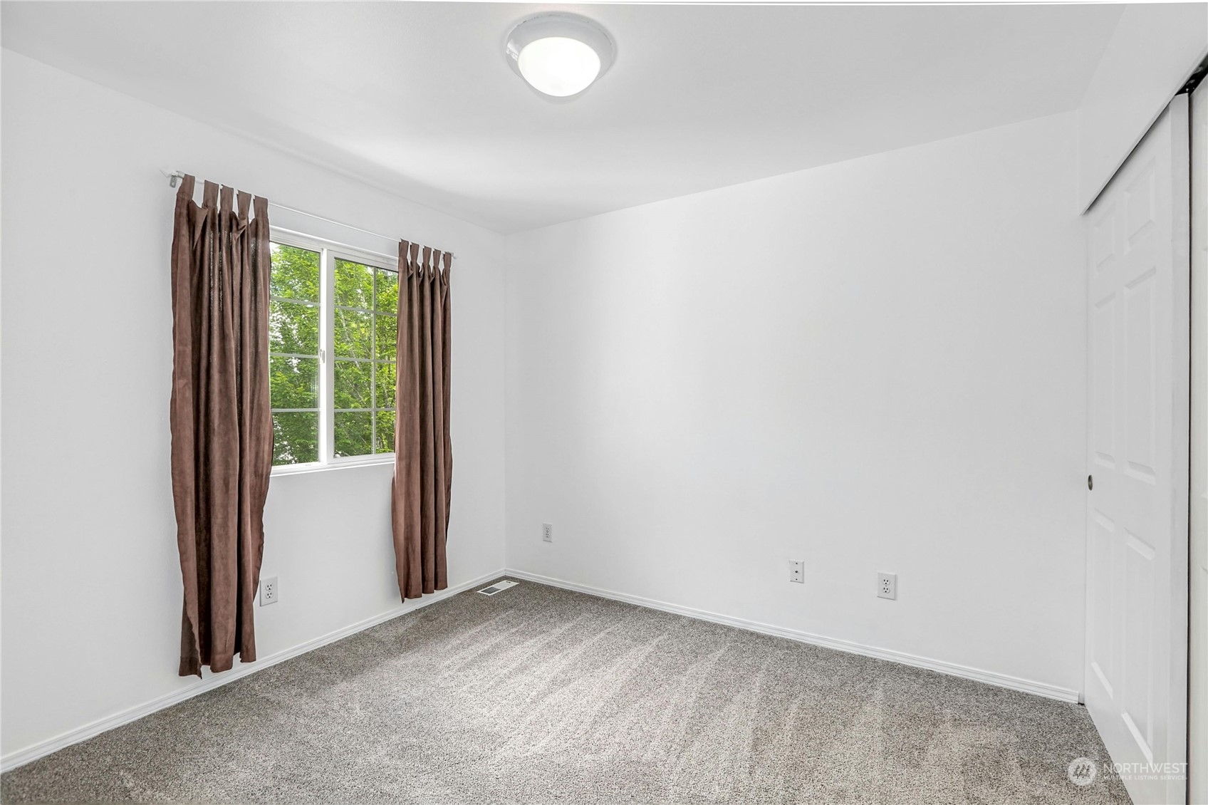 15028 51st Drive Southeast Bothell, WA 98012 - Photo 22 of 31 a view of a room with a large window