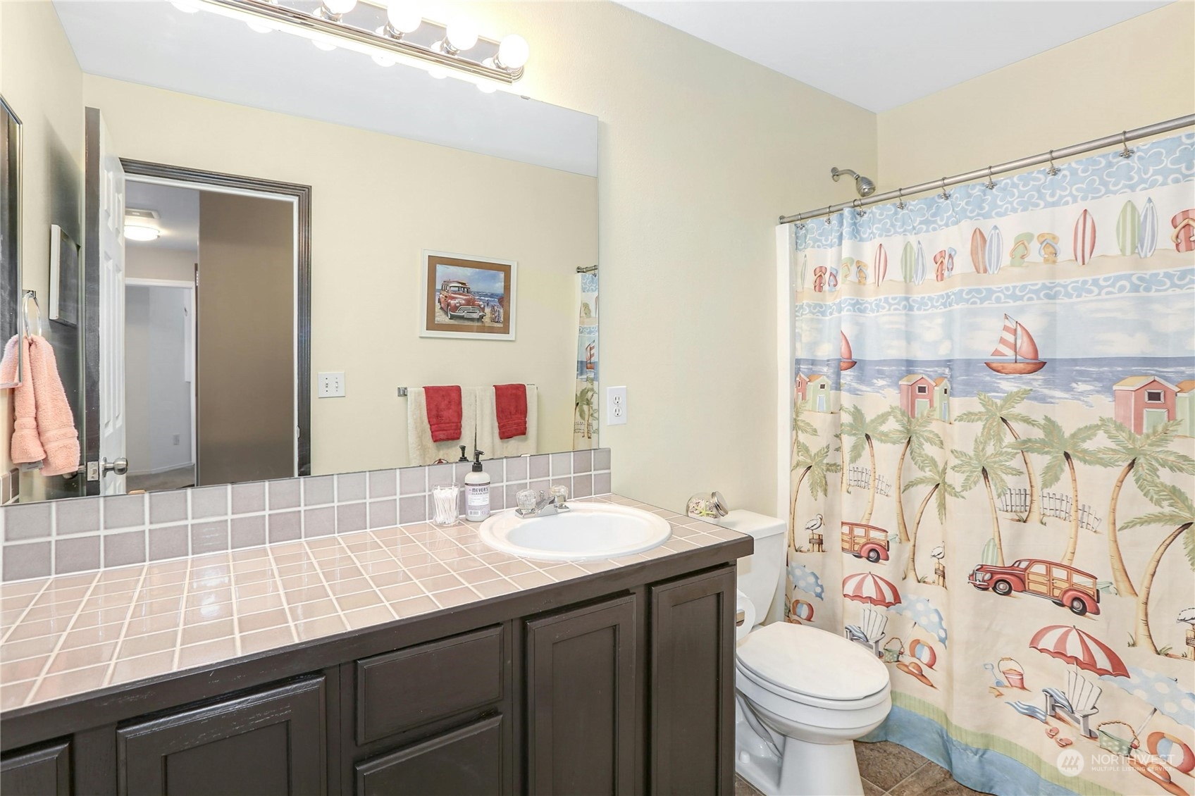 15028 51st Drive Southeast Bothell, WA 98012 - Photo 23 of 31 a bathroom with a sink a toilet and shower curtain