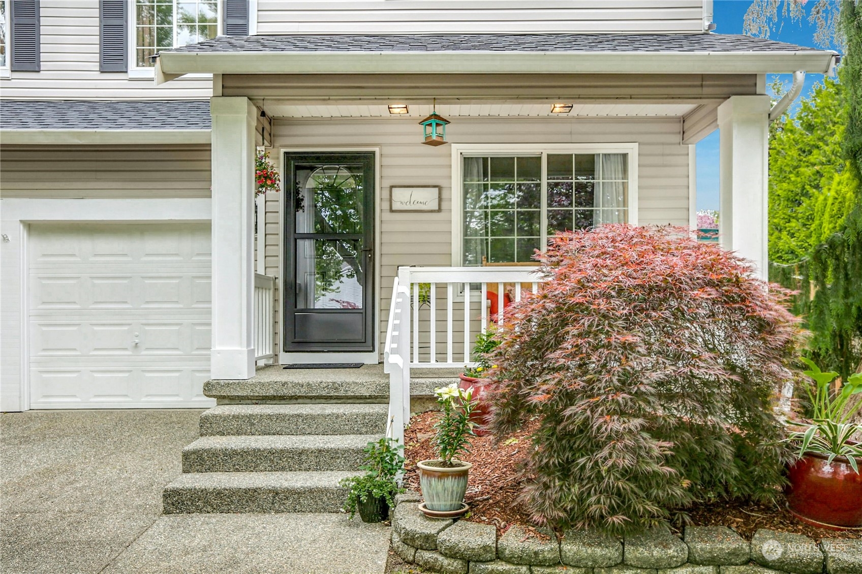 15028 51st Drive Southeast Bothell, WA 98012 - Photo 3 of 31 a front view of a house with plants and windows