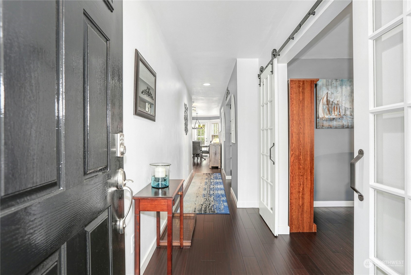15028 51st Drive Southeast Bothell, WA 98012 - Photo 5 of 31 a view of a hallway with wooden floor windows and livingroom