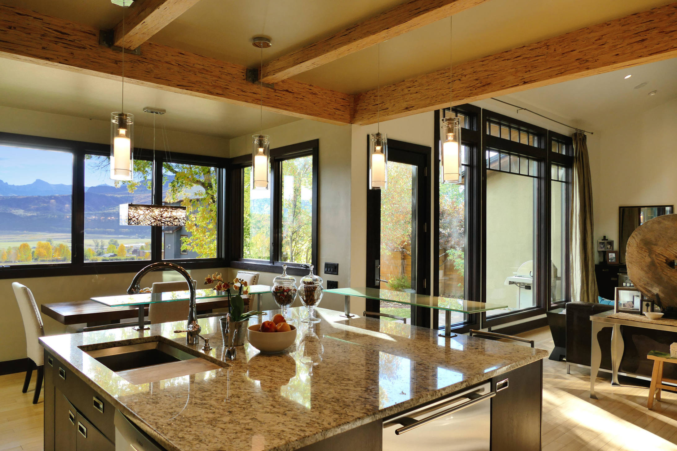 420 Amy Way Ridgway, CO 81432 - Photo 6 of 17 a kitchen with kitchen island granite countertop a sink and a table