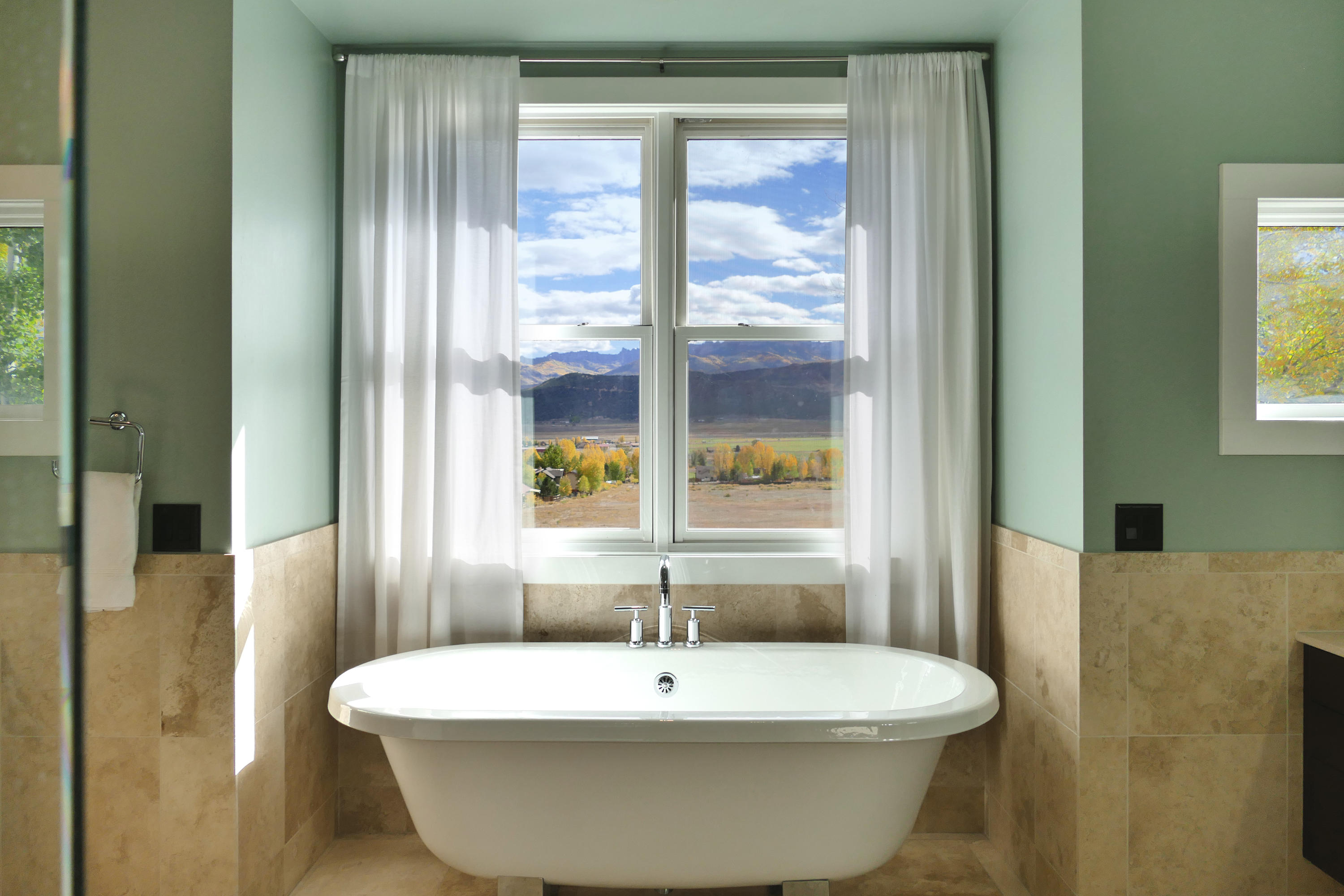 420 Amy Way Ridgway, CO 81432 - Photo 9 of 17 a white bath tub sitting next to a window