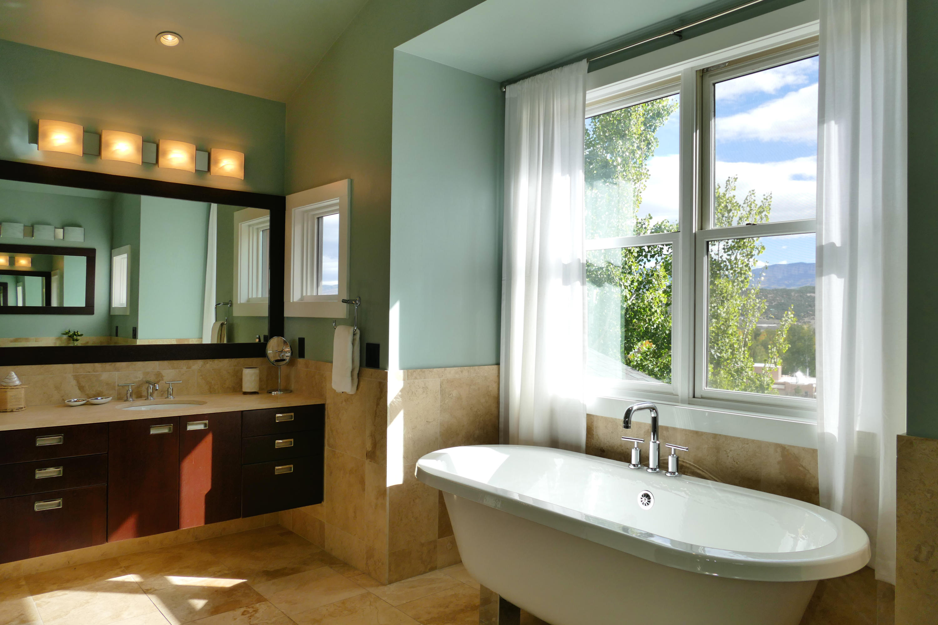 420 Amy Way Ridgway, CO 81432 - Photo 10 of 17 a bathroom with a tub sink and mirror