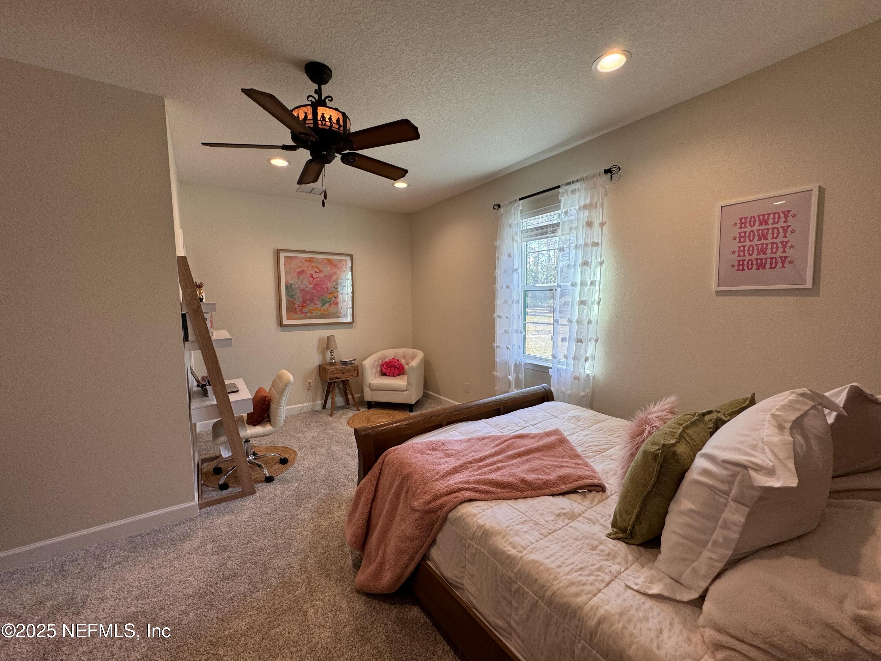 34424 Mitigation Trail Callahan, FL 32011 - Photo 19 of 44 a bedroom with a bed and window