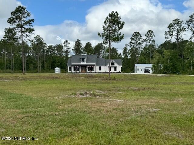 34424 Mitigation Trail Callahan, FL 32011 - Photo 2 of 44 a view of a house with a big yard