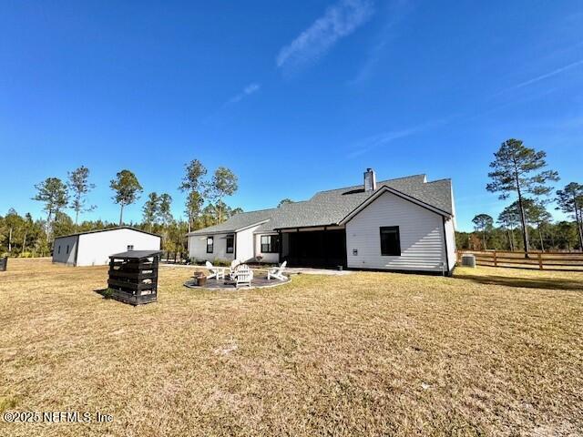 34424 Mitigation Trail Callahan, FL 32011 - Photo 28 of 44 a blue and white house with a yard