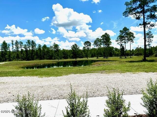 34424 Mitigation Trail Callahan, FL 32011 - Photo 34 of 44 a view of a golf course with a lake view