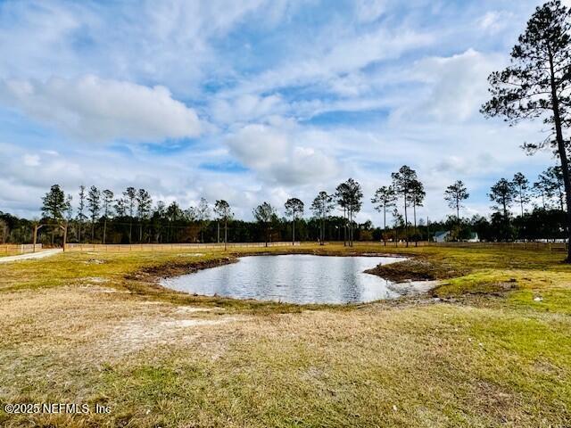 34424 Mitigation Trail Callahan, FL 32011 - Photo 35 of 44 a view of a swimming pool with an outdoor seating