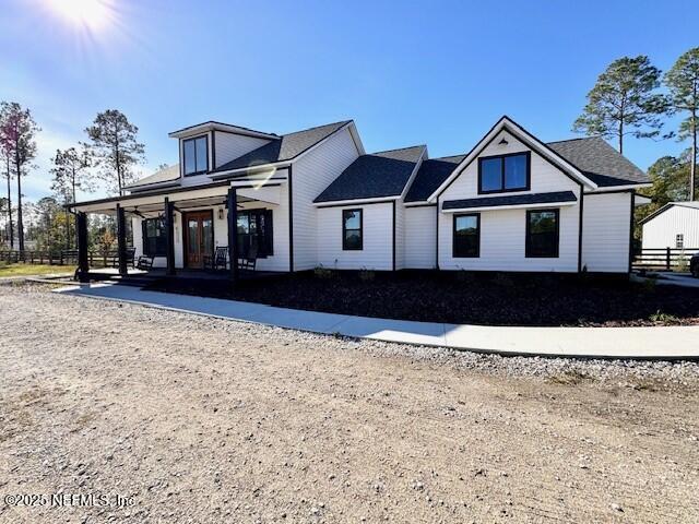 34424 Mitigation Trail Callahan, FL 32011 - Photo 4 of 44 a view of a house with a yard