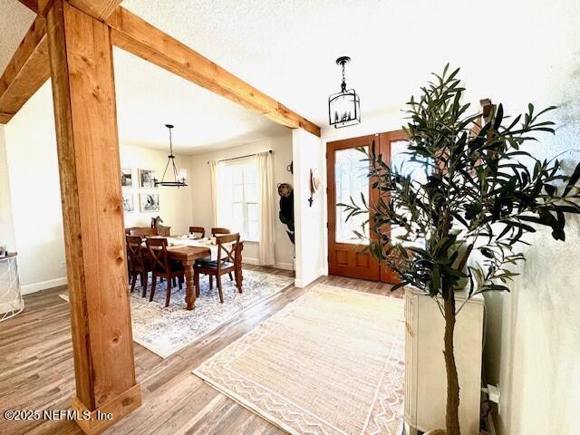 34424 Mitigation Trail Callahan, FL 32011 - Photo 5 of 44 a view of a dining room with furniture window and wooden floor